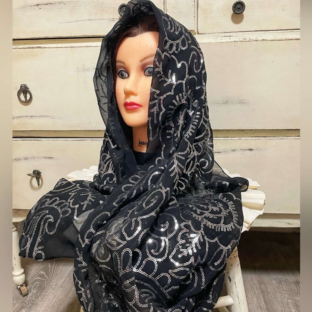 Elegant black sheer scarf featuring delicate silver sequin